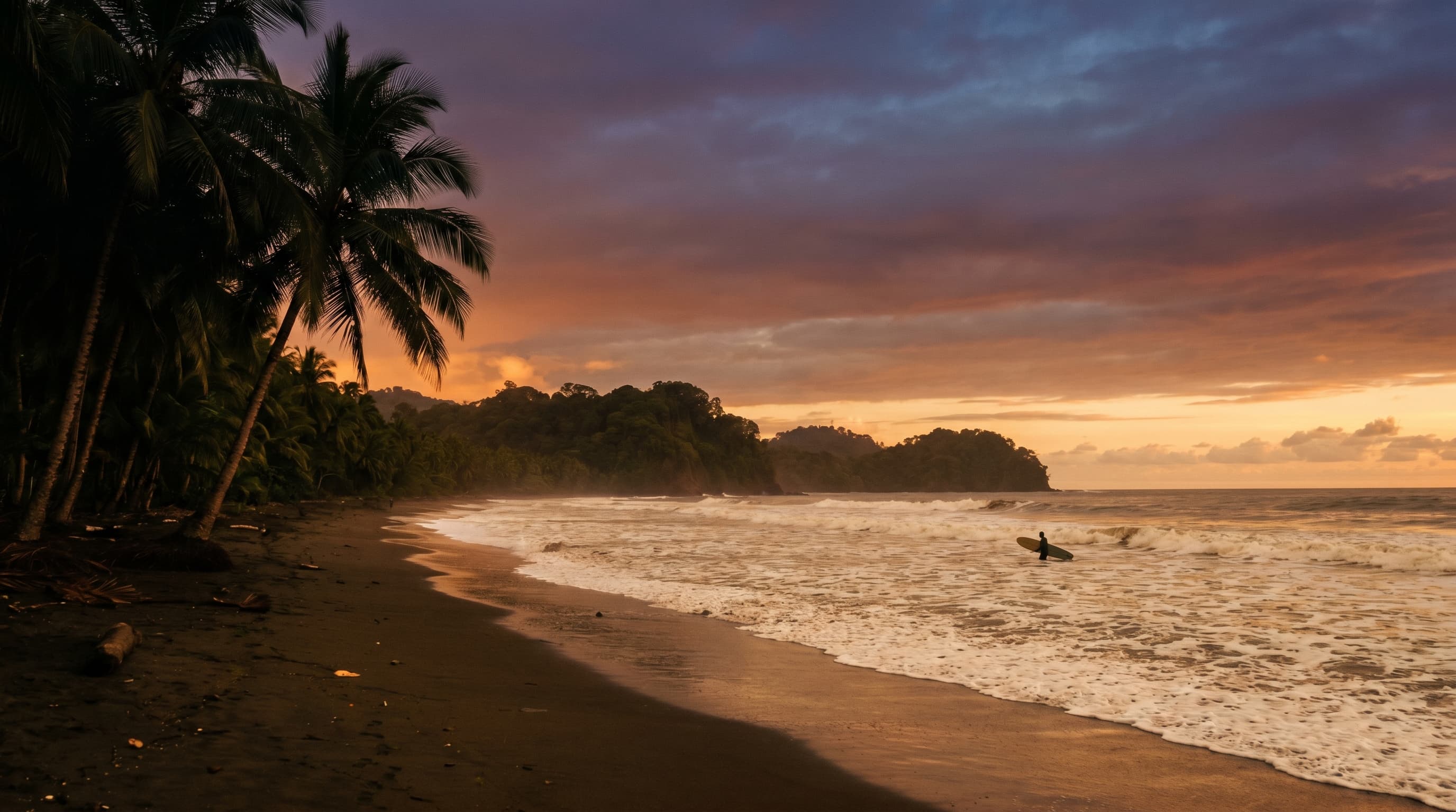 Dominical Costa Rica beach at sunset with palm-tree silhouettes